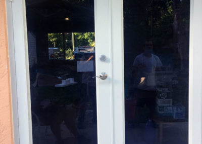 Tinted impact windows with white frame